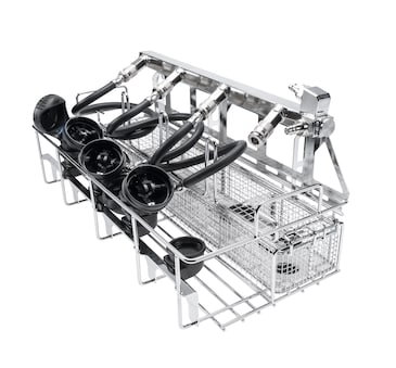 Stainless steel instrument washer rack with hose connectors and wire baskets for cleaning medical tubing and parts.